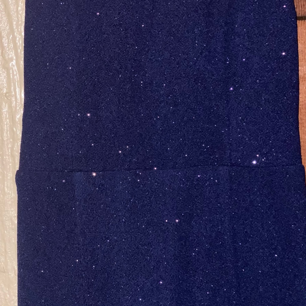 This a long sparkling navy blue beautiful dress made by speechless